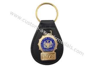 L'abitudine della polizia di New York ha personalizzato Keychain di cuoio con l'emblema molle d'ottone dello smalto, oro placcato